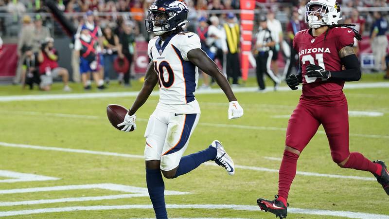 Denver Broncos wide receiver Jerry Jeudy, left, scores in front of Arizona Cardinals safety...