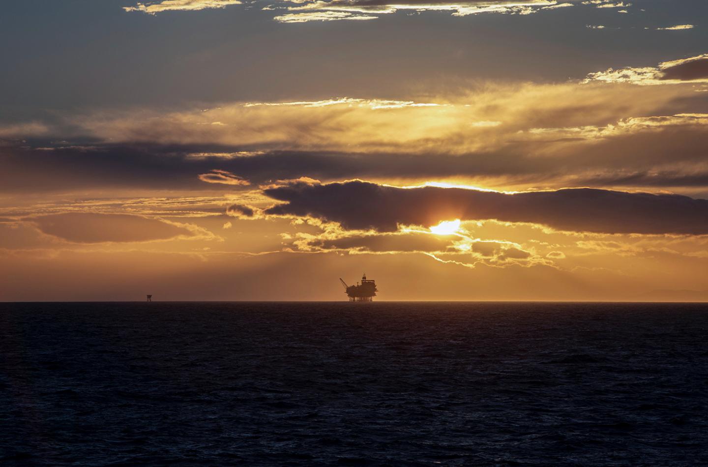 Oil rig at sunset