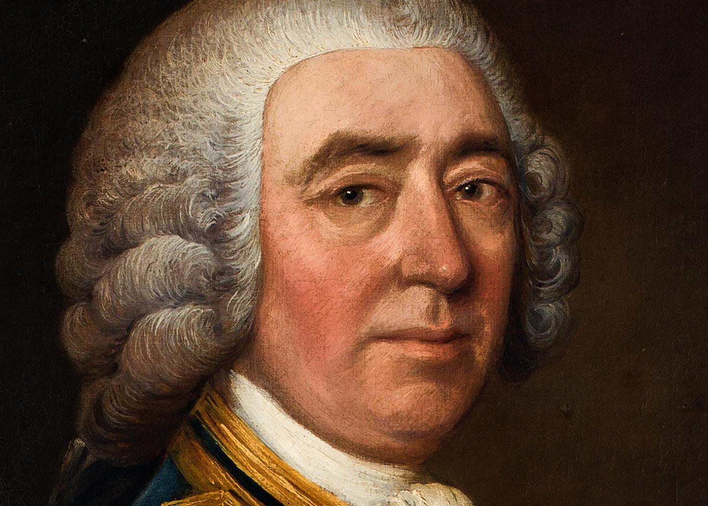 A close up view of a painting of a naval commander, showing the portrait sitter's face. He is wearing a curly grey wig and looking directly at the viewer with a steady gaze