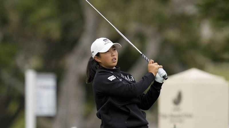 Ruoning Yin, of China, watches her tee shot on the 17th hole during a practice round for the...