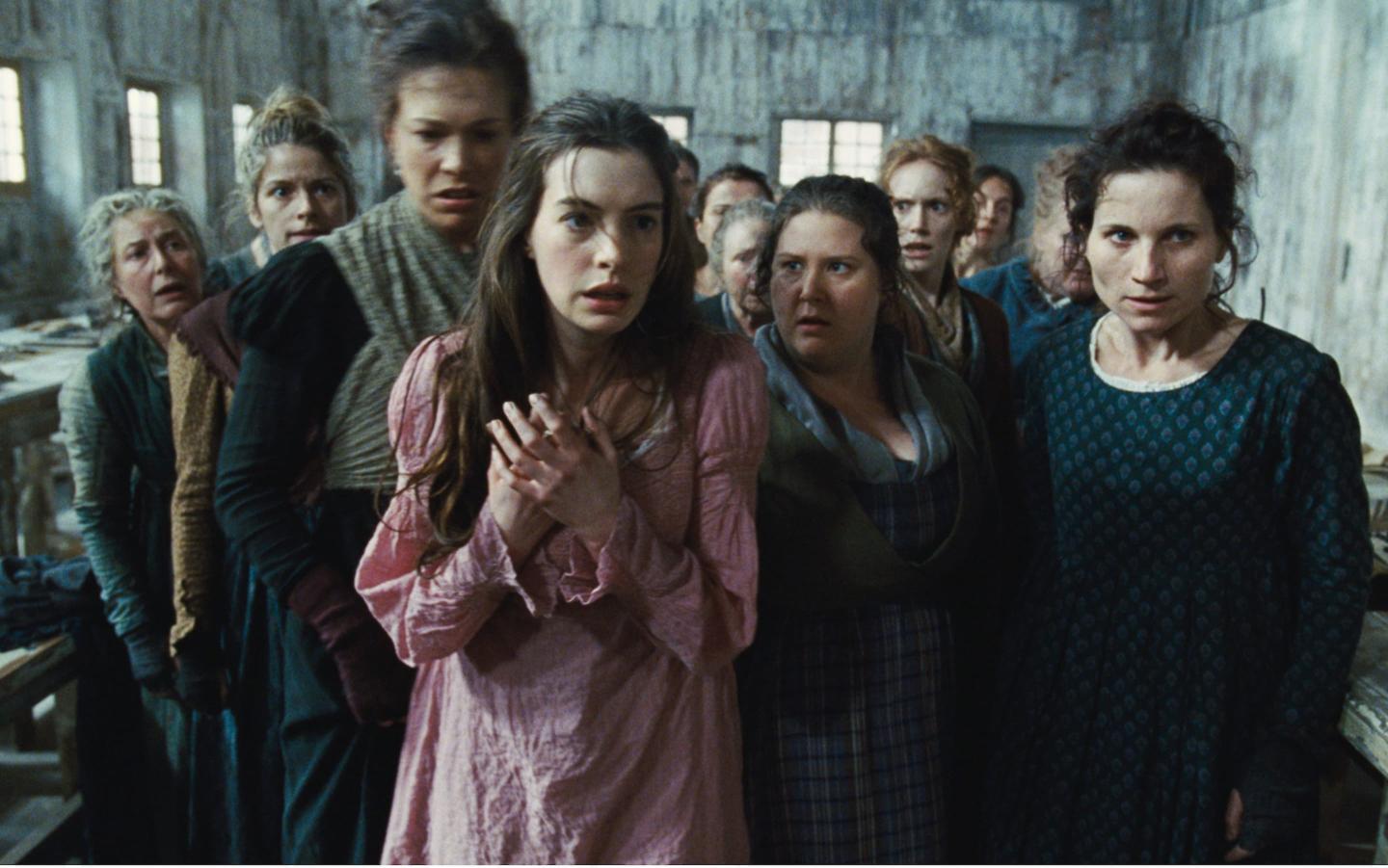 Cast of Les Miserables in a derelict building