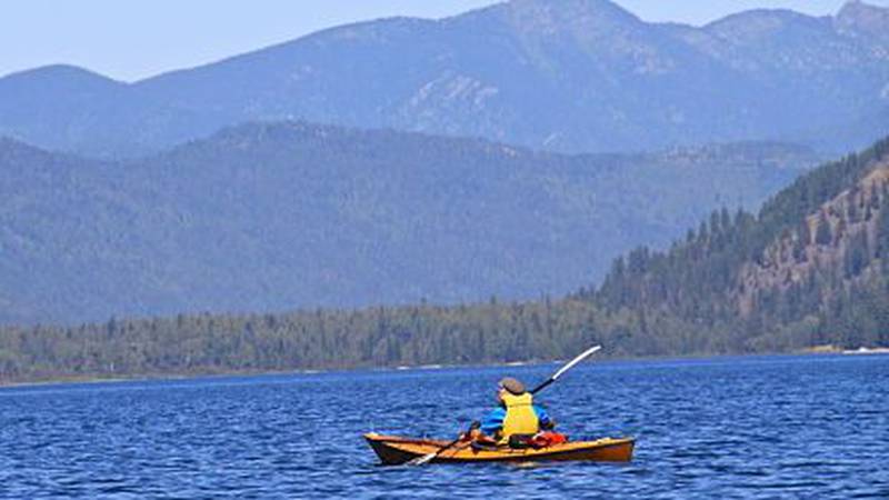 This undated AP photo shows a kayaker paddling across Upper Priest Lake, Idaho