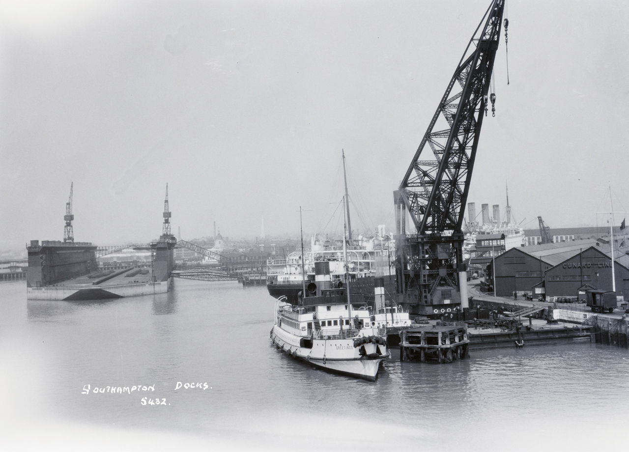 P95226; The passenger tender Greetings (1914)  alongside Berth 48 in Southampton docks, Hampshire.