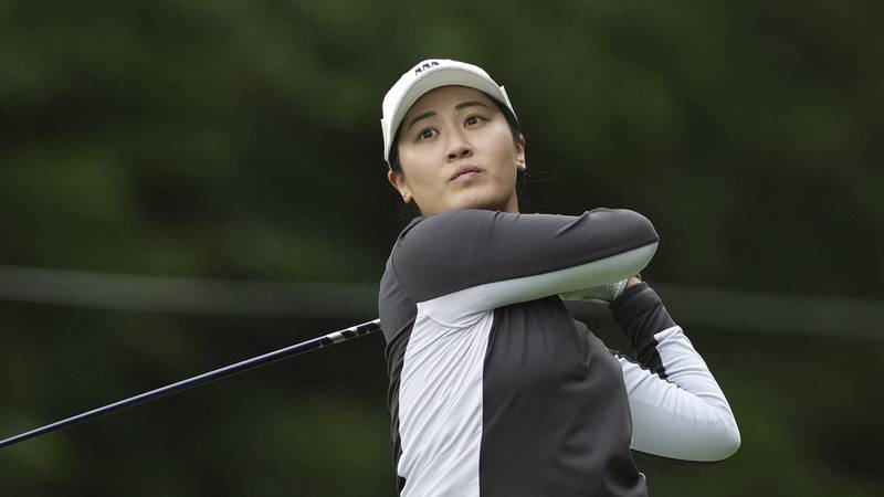 Xiyu Lin, of China, tees off on the second hole during the first round of the Women's PGA...