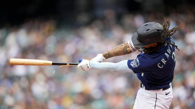 Seattle Mariners' J.P. Crawford breaks his bat on a swing in a baseball game against the...